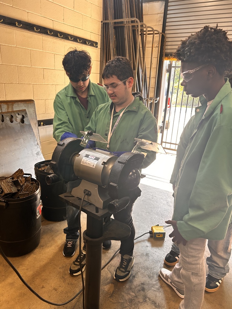 students working on a machine