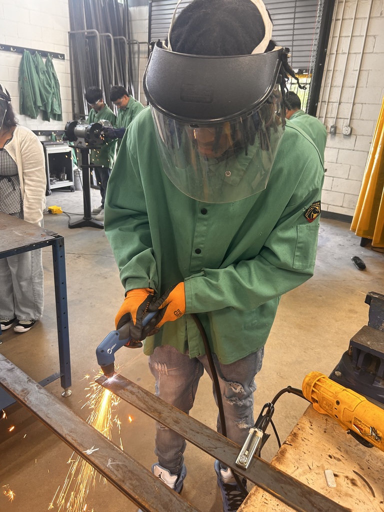 student learning how to weld