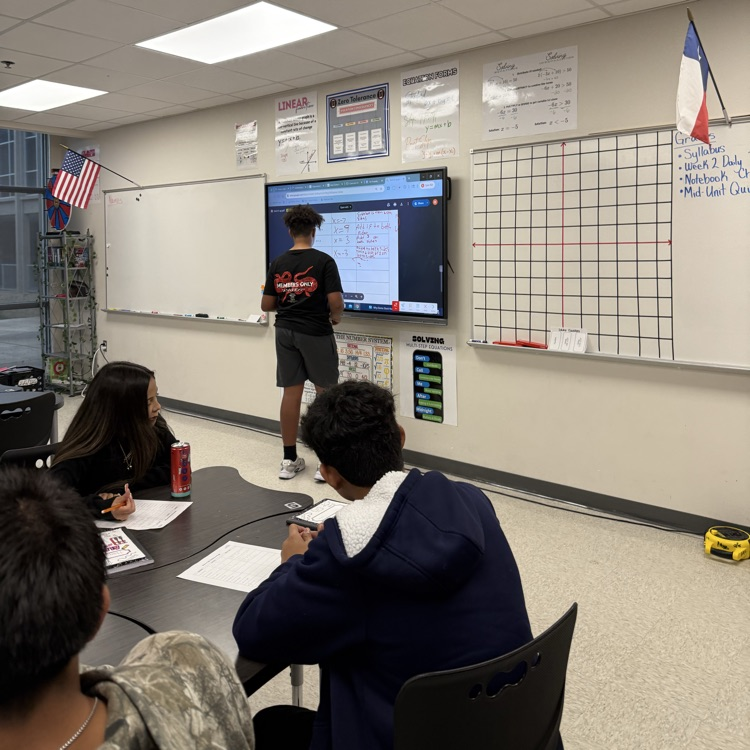 student working at the board