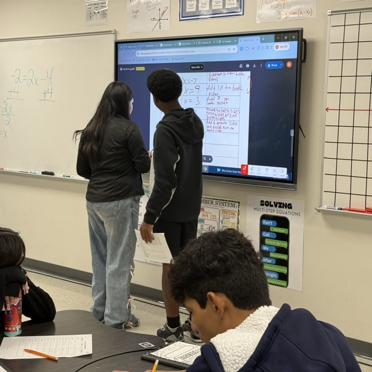 students at the board