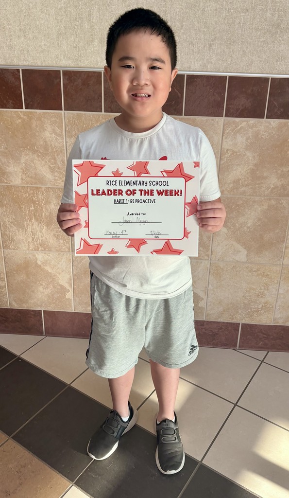 boy holding certificate