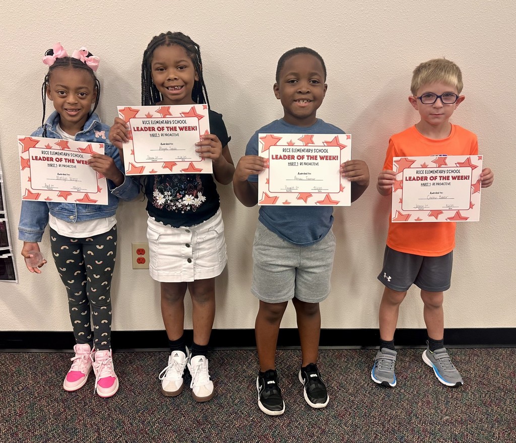 2 girls and 2 boys holding certificate