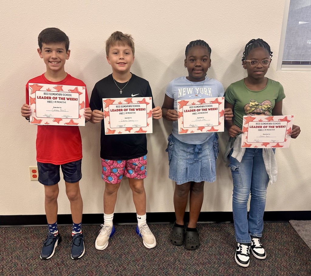 2 boys and 2 girls holding certificate