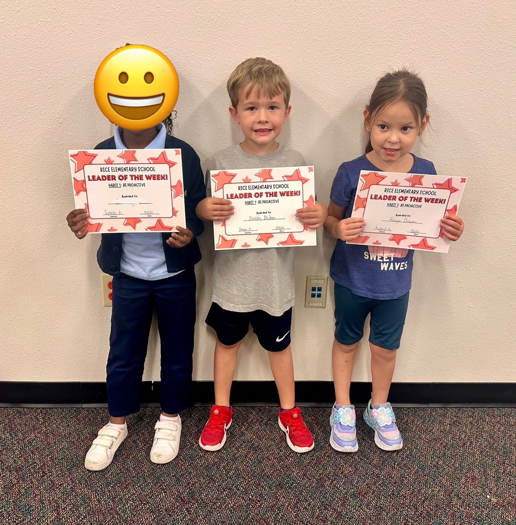 a boy and a girl holding certificates