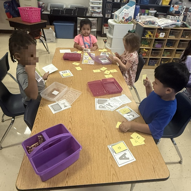 Pre-K students working in stations