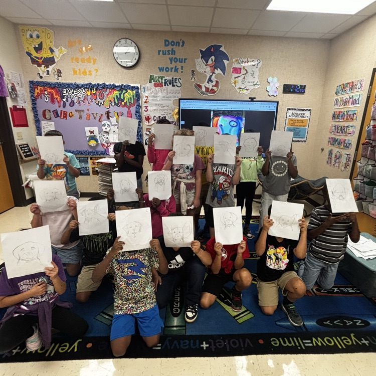 students showing off their expressionist art project puppy drawings