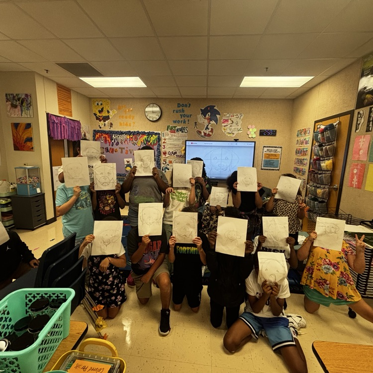 Students showing off their expressionist art project puppy drawings