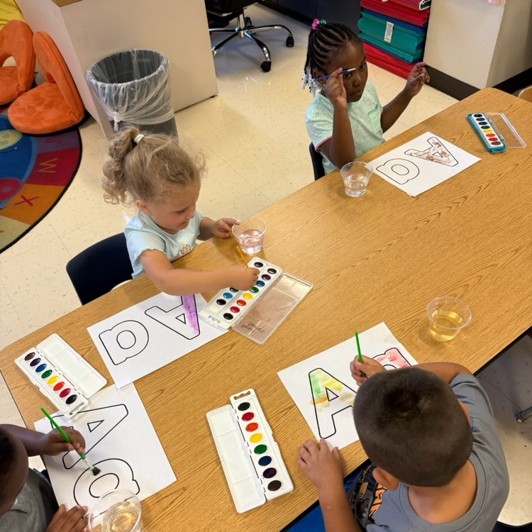 Pre-K students, watercolor, painting the letter a