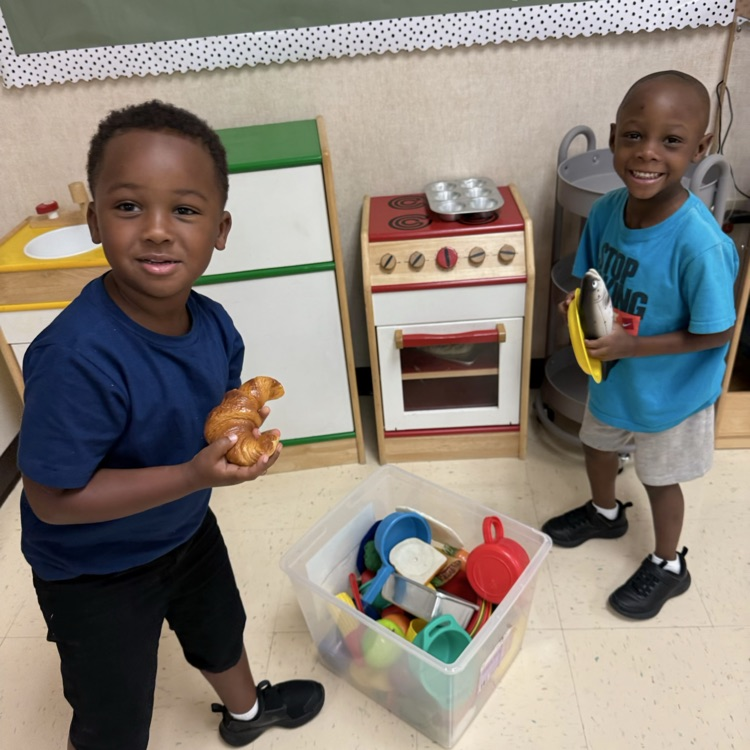 Pre-K students playing in the home station