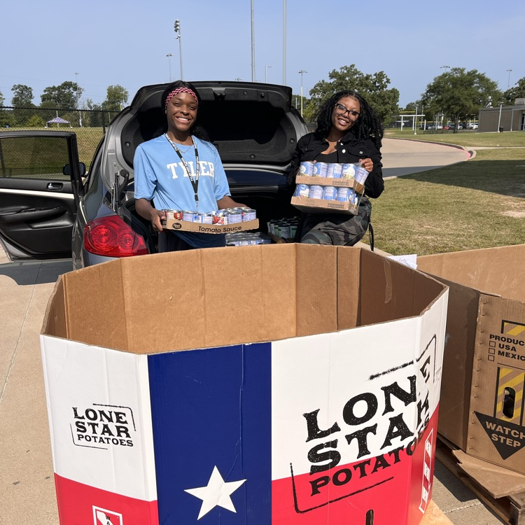 ladies loading canned goods in the boxes
