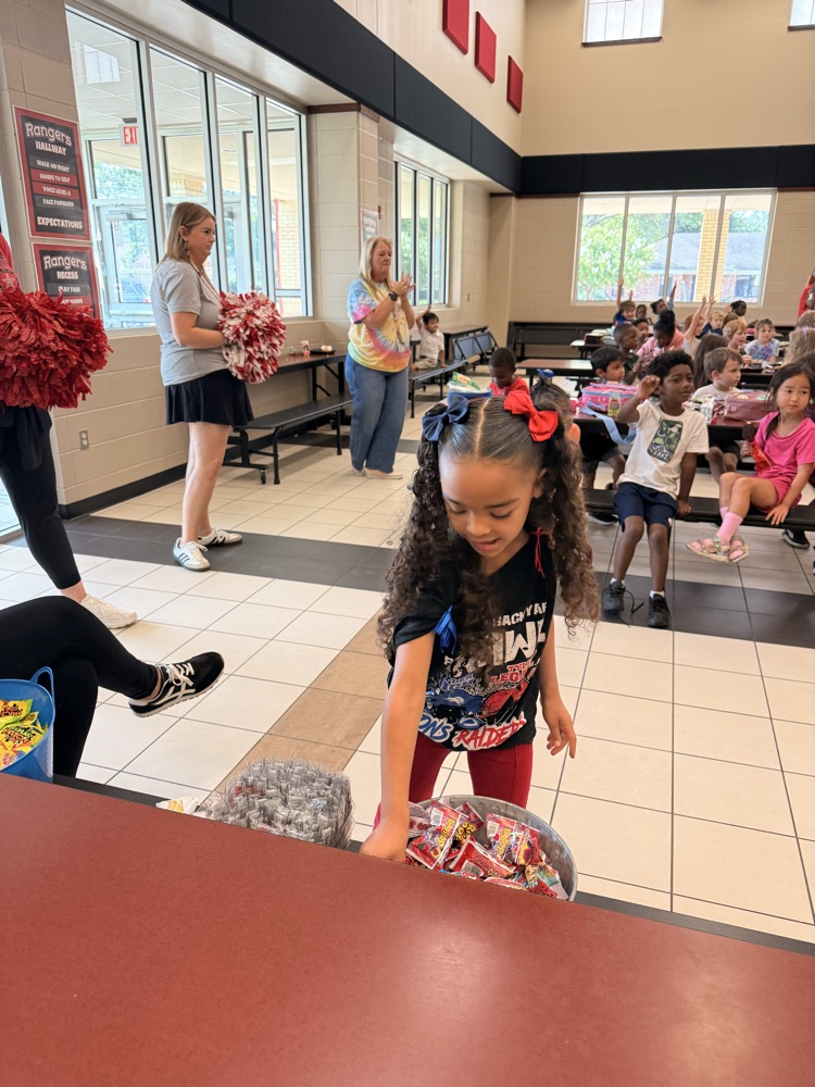 student choosing a prize