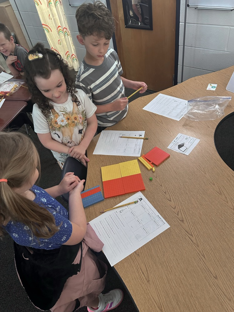 students working together to solve a math problem