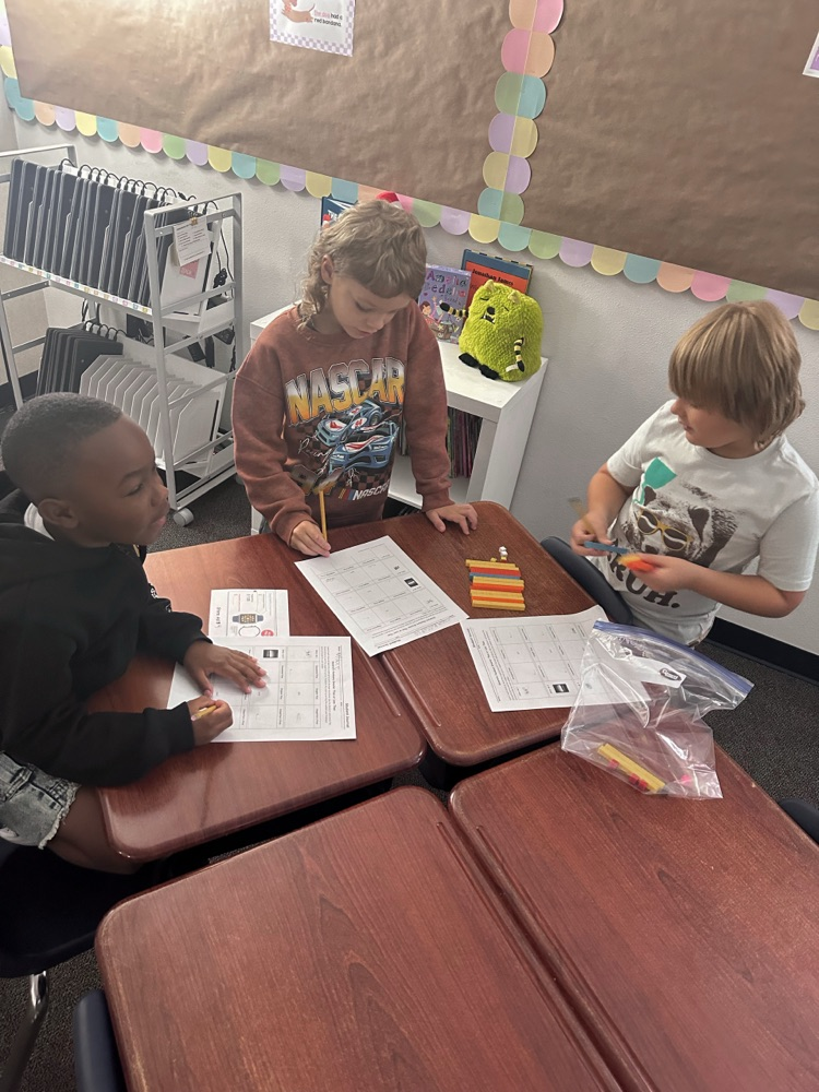 students working together to solve a math problem