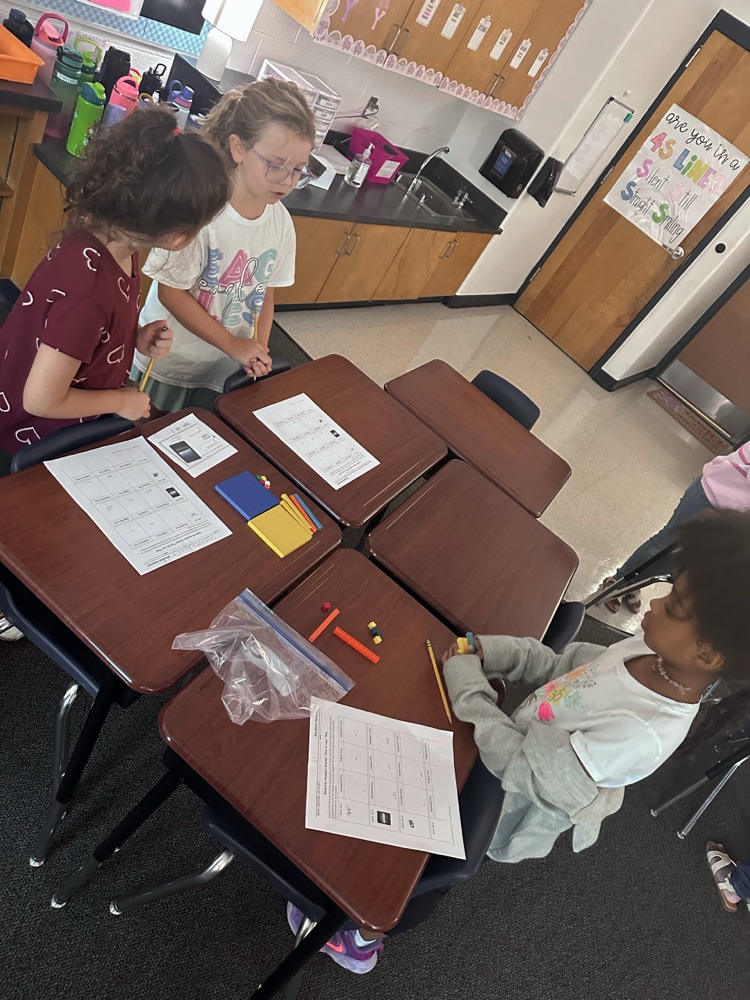 students working together to solve a math problem
