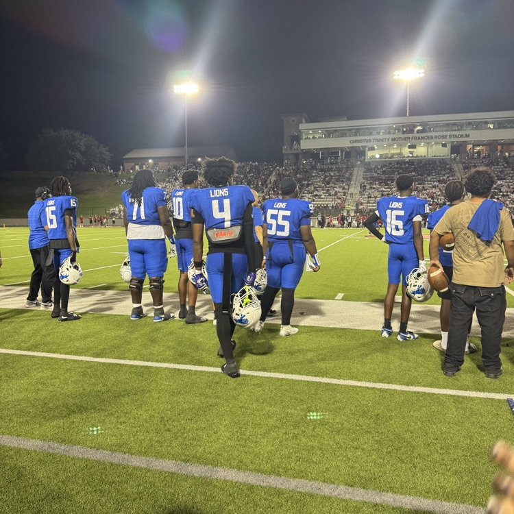 football players on sidelines