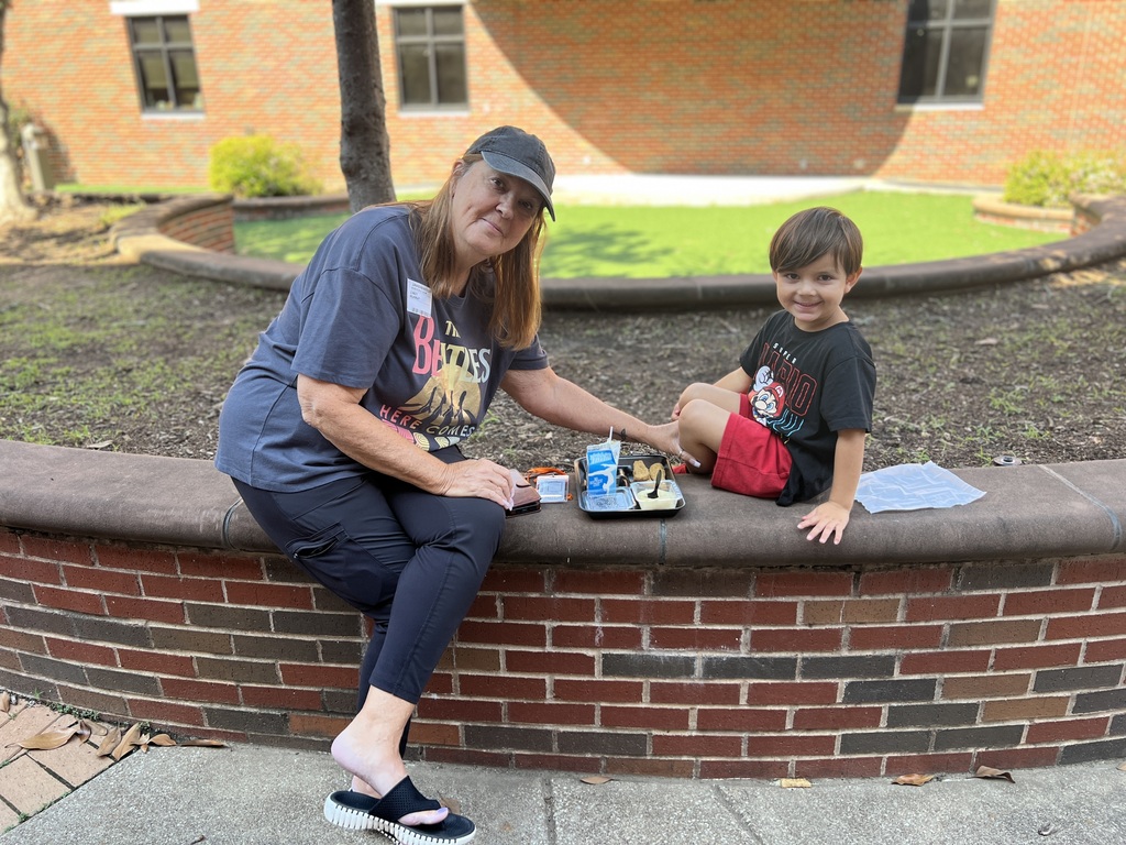 woman smiling with grandson