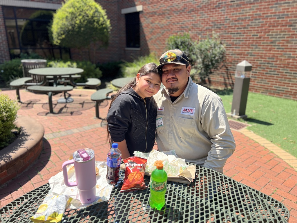 man smiling with daughter