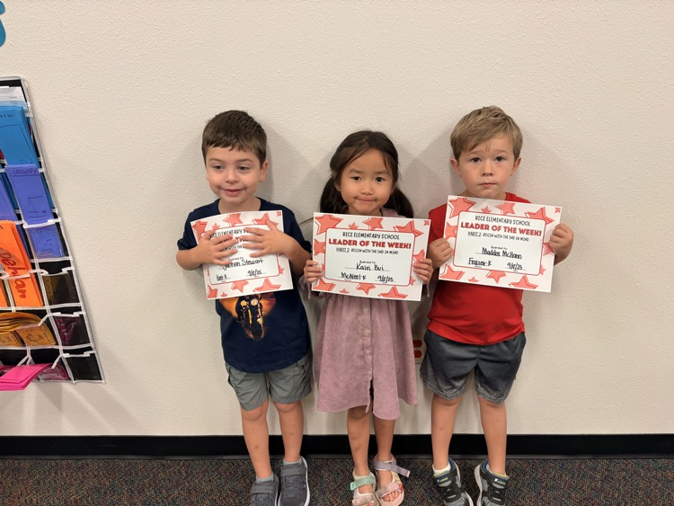 students holding certificates
