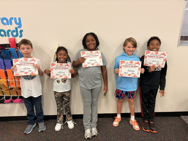students holding certificates