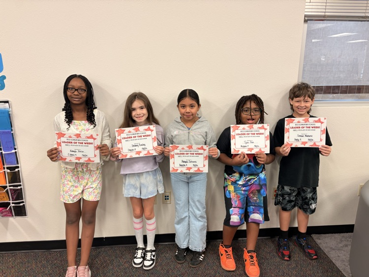 students holding certificates