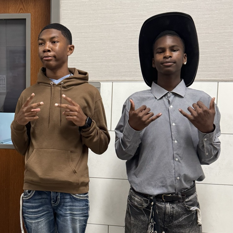 two guys dressed western