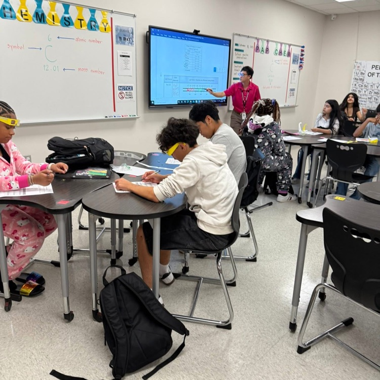 students in desks doing classwork