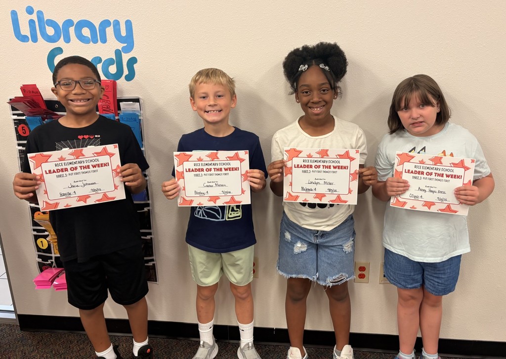 four students holding up a certificate