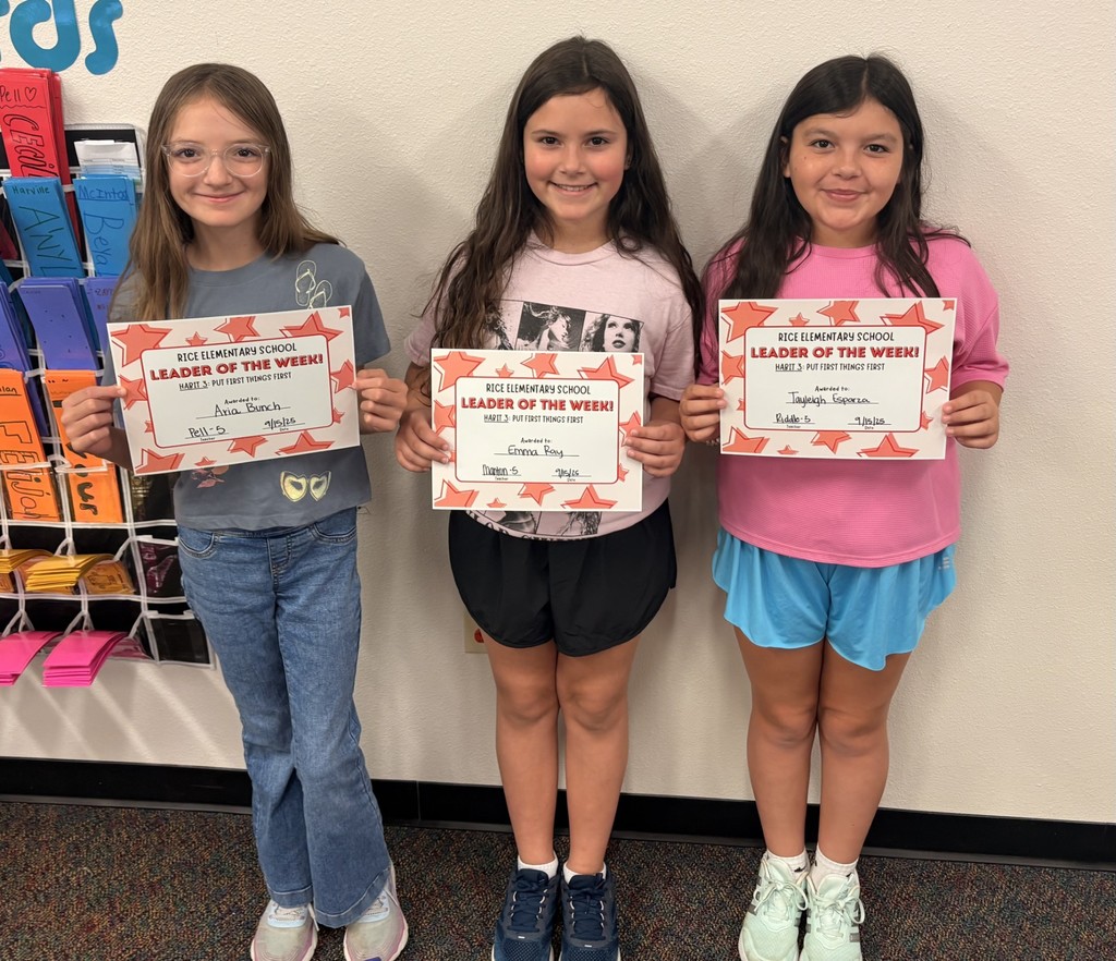 three students holding up a certificate