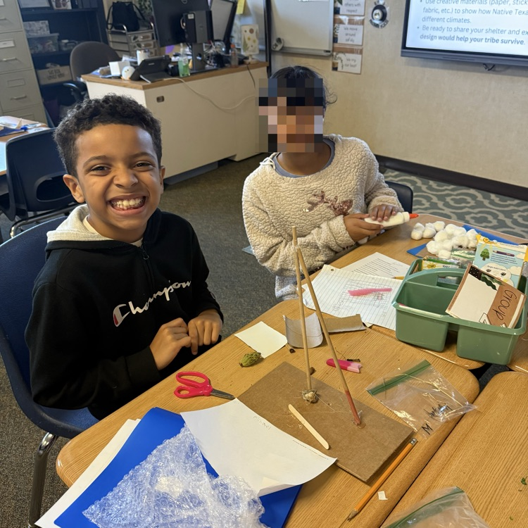 student working on STEM project Native American homes