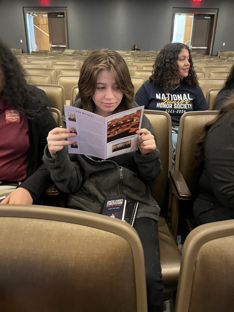 girl looking at book