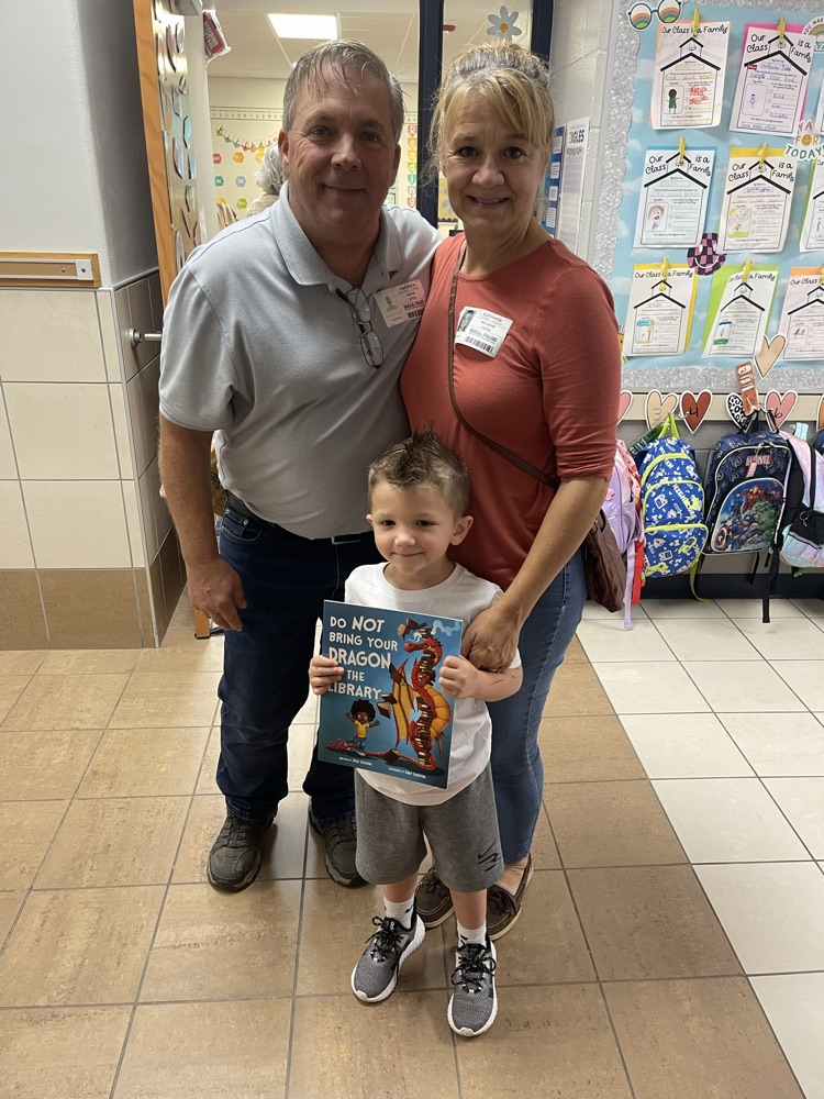 child with grand friends after shopping at the book fair