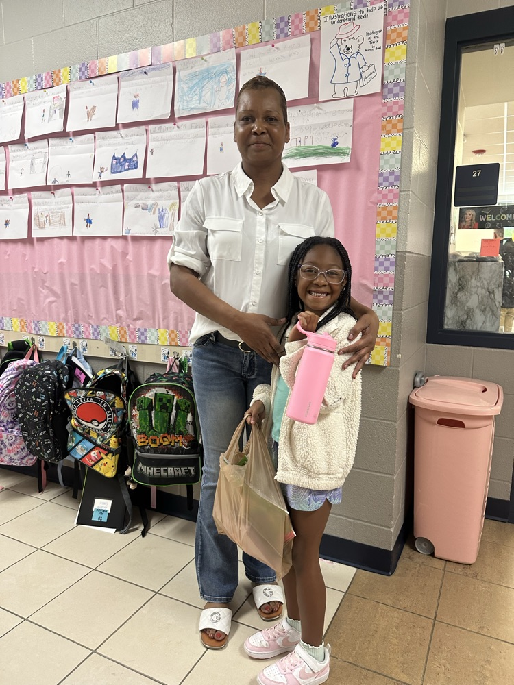 child with grand friends after shopping at the book fair