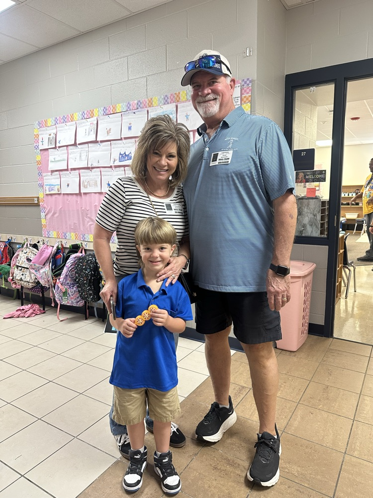 child with grand friends after shopping at the book fair