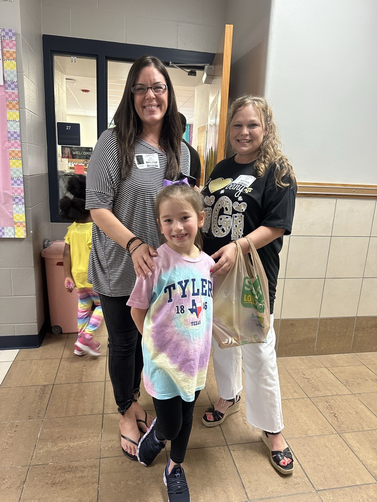 child with grand friends after shopping at the book fair