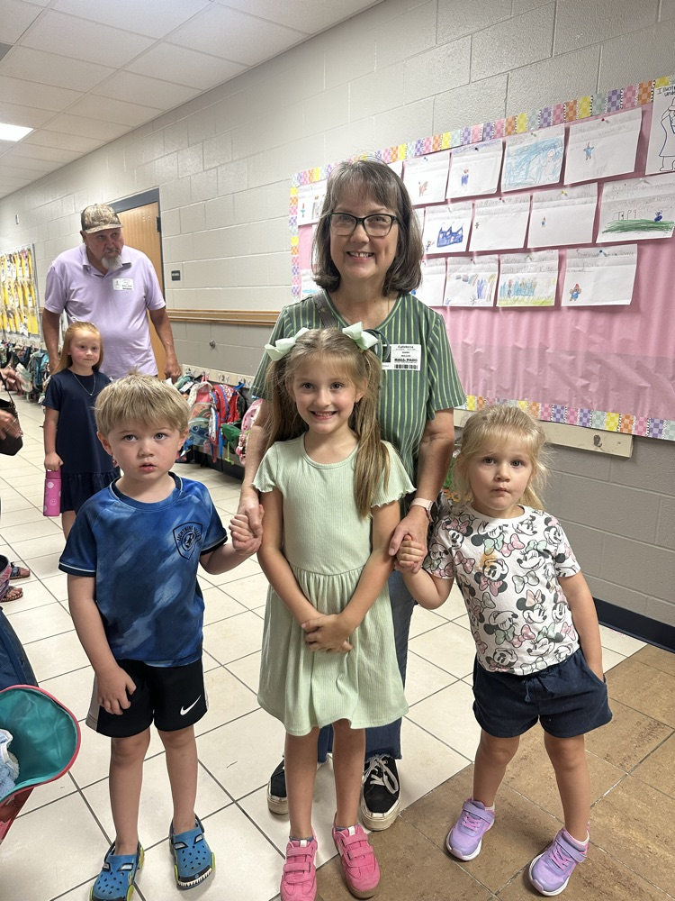 child with grand friends after shopping at the book fair