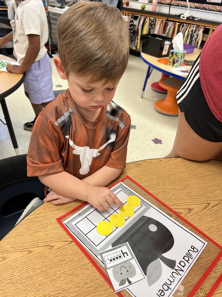 Student doing math involving apples.