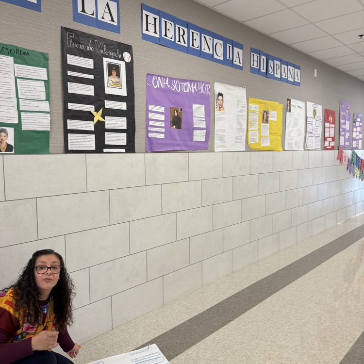 lady with posters on the wall