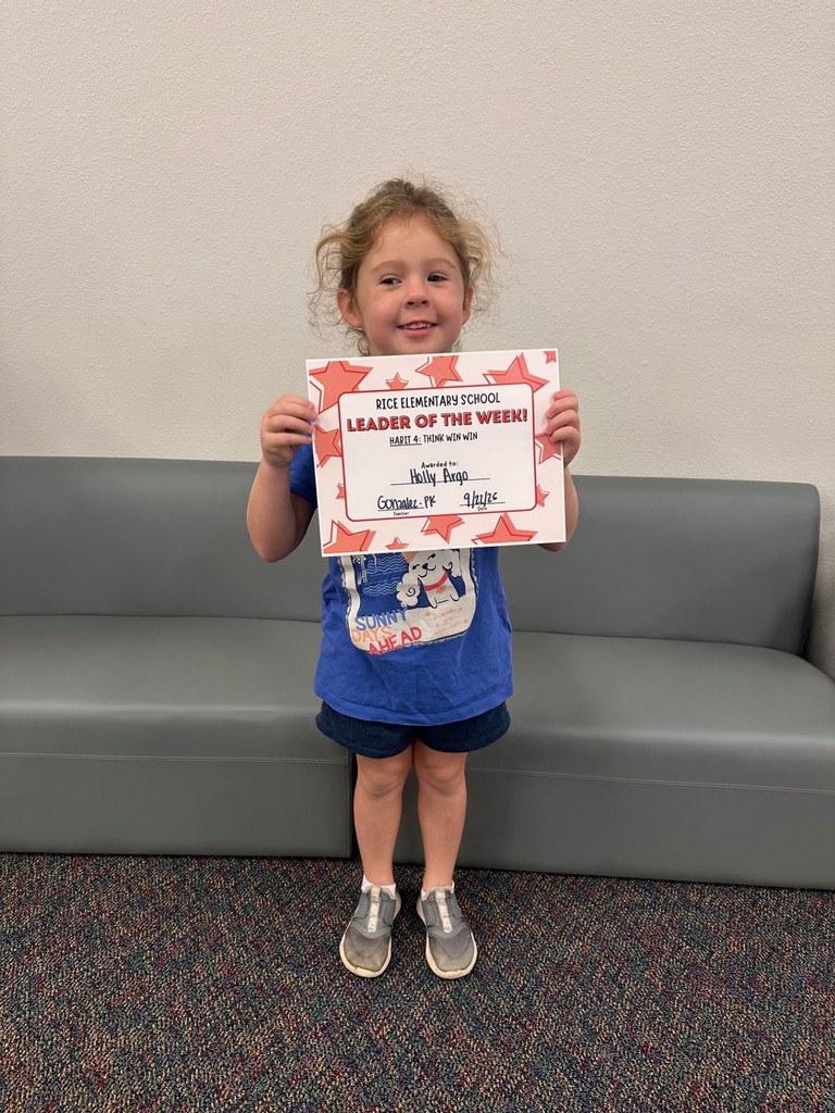 student holding a certificate