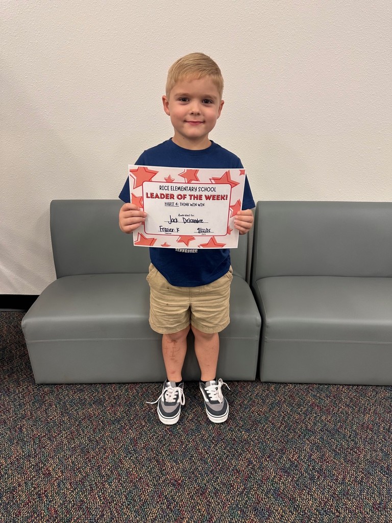 student holding a certificate