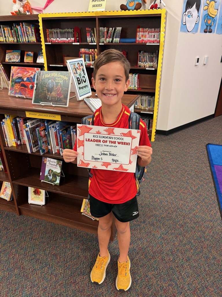 student holding a certificate