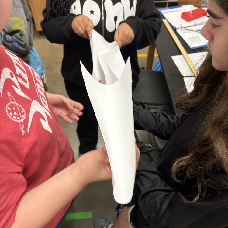 students racing a ping pong ball 