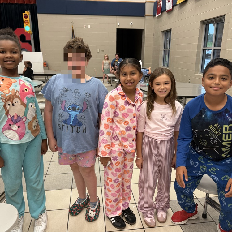 Student dressed up in pajamas in the cafeteria