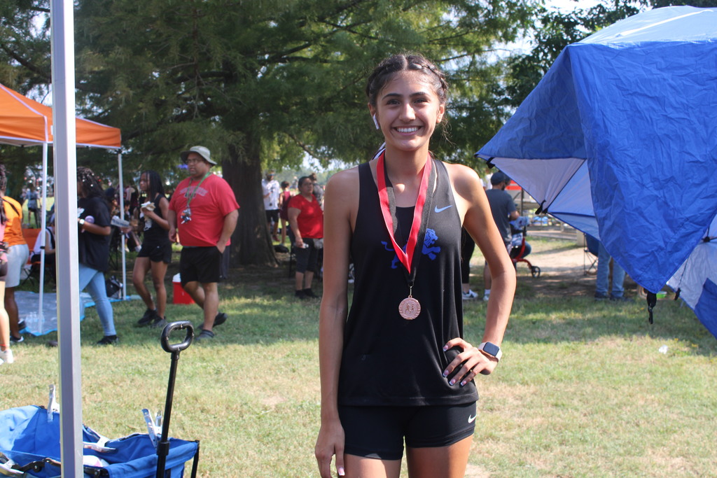 girl wearing her medal