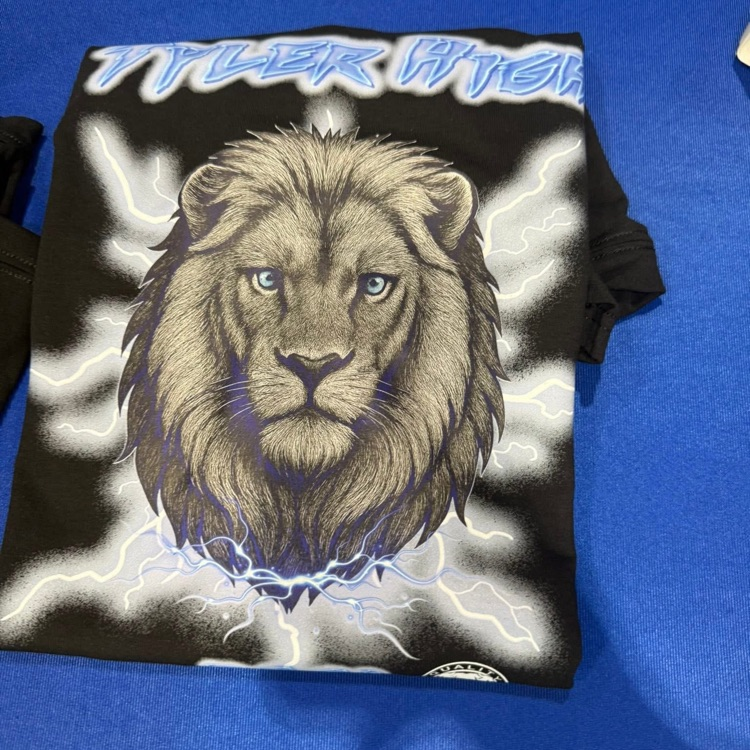 shirt with lion on it