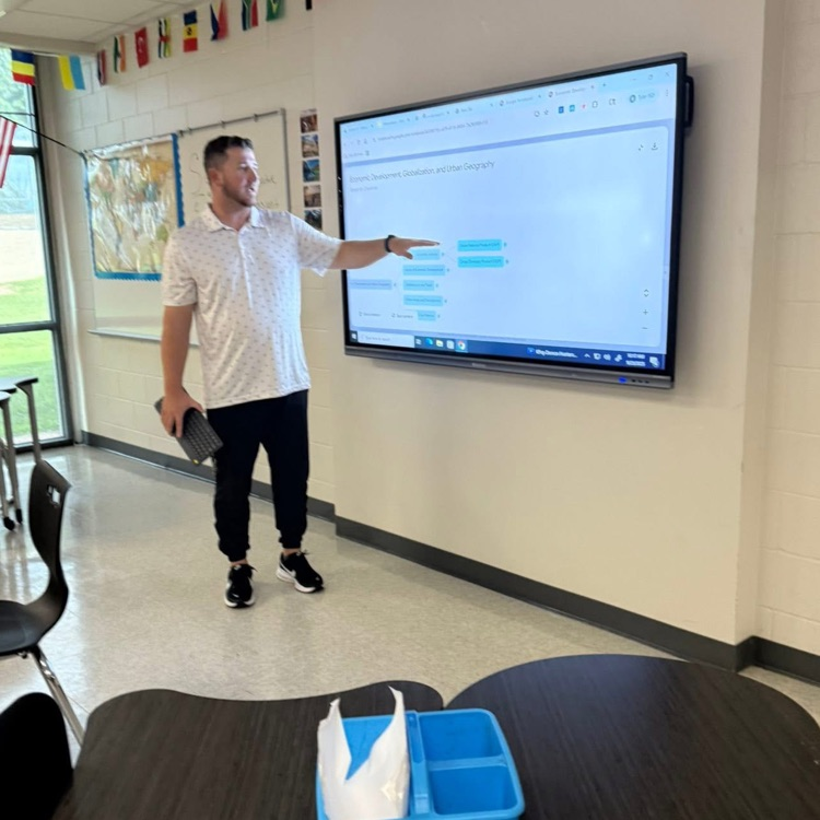 teacher at board teaching