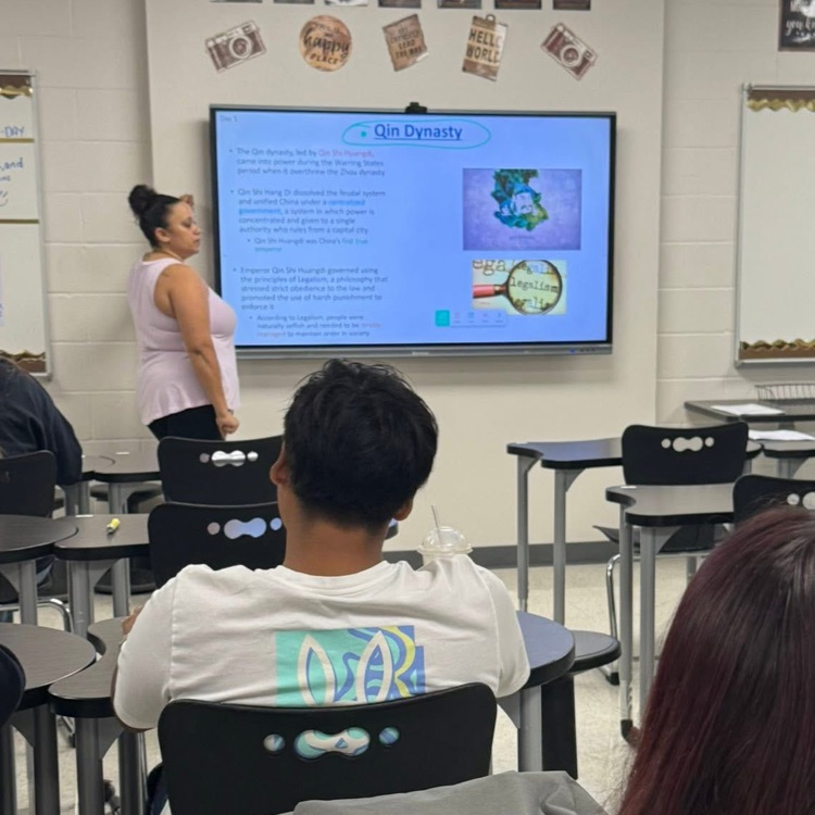 teacher at board teaching