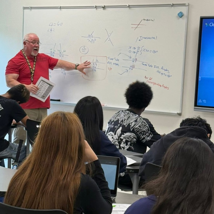 teacher at board teaching