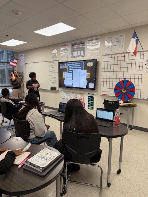 student at board working a math problem