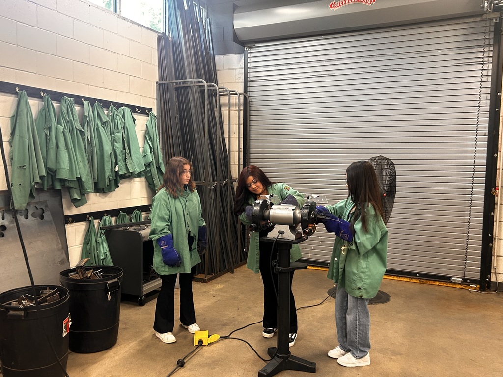 students at cutting machine