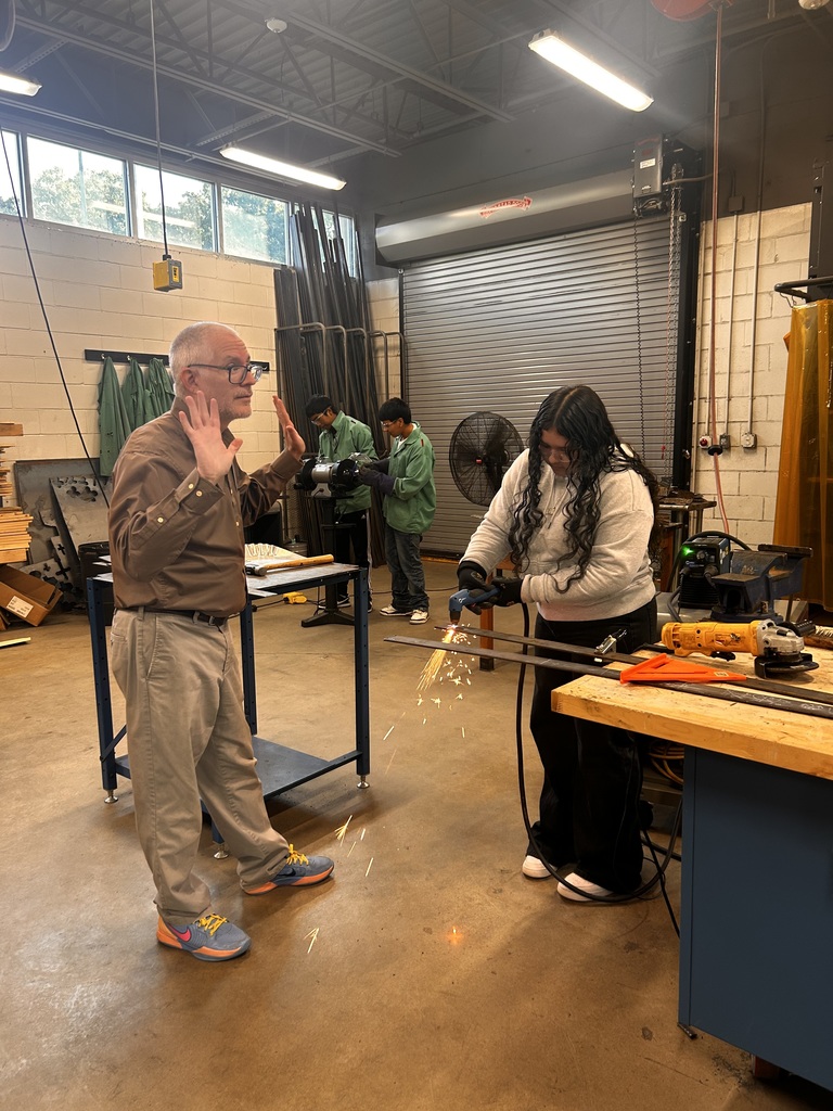 student using a welder